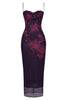 Dark purple dress with floral lace details on a white background